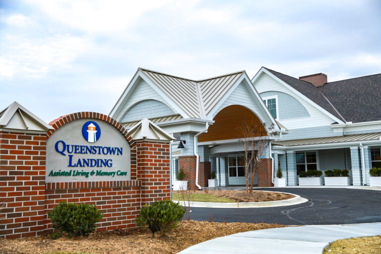 Queens Landing front entrance and monument sign